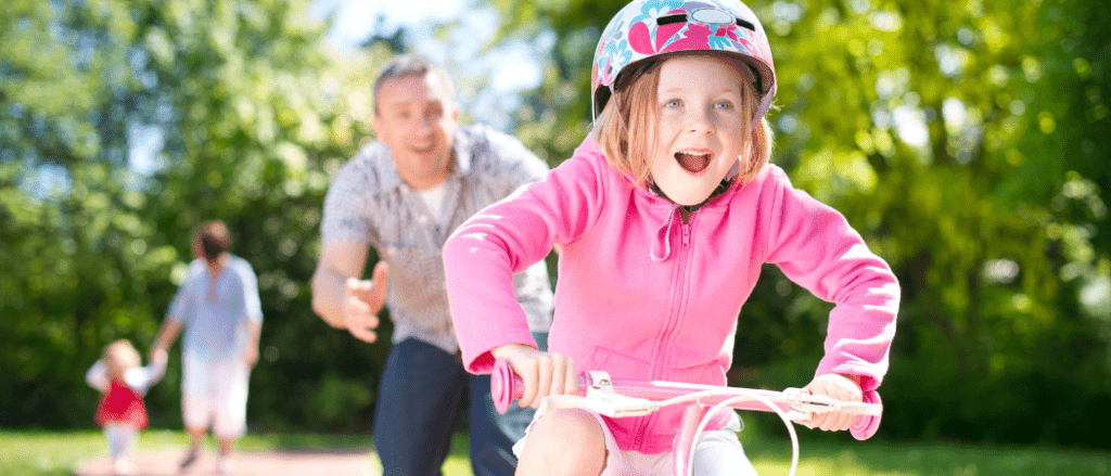 Girl riding bike for first time